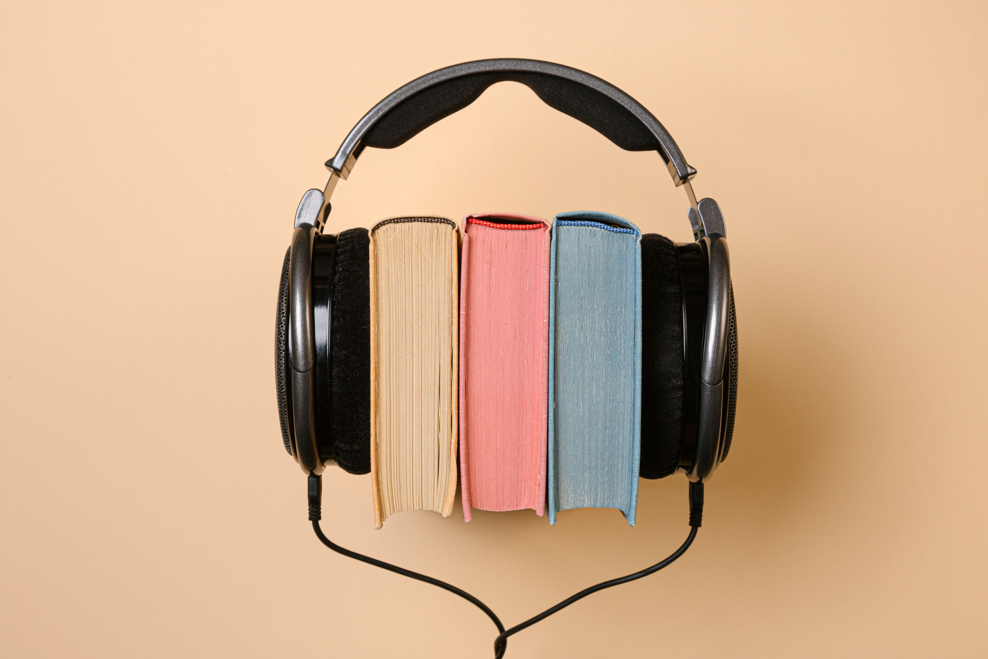 Books with headphones as an editorial image